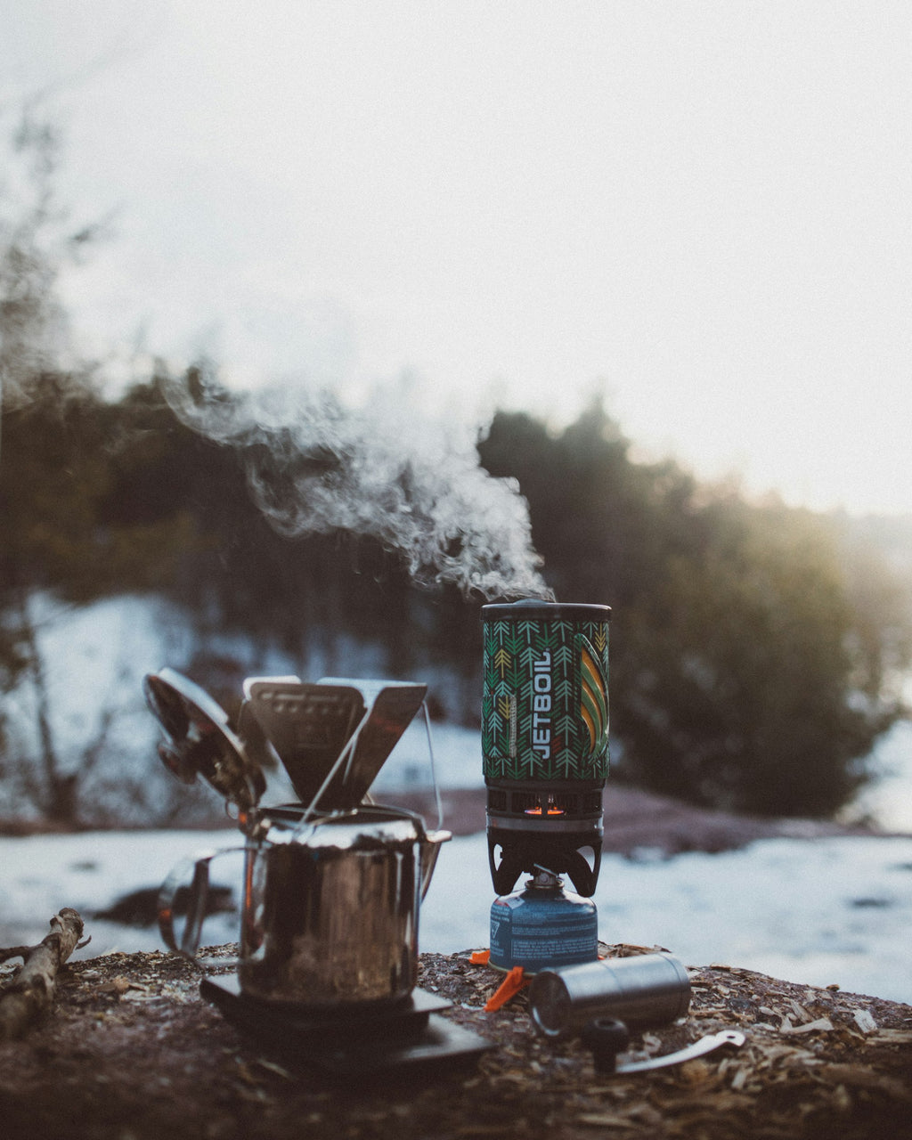 Portable ultralight camping stove in daylight camp setting